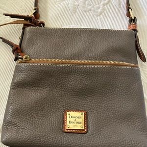 Brand new Dooney and Bourke crossbody bag.